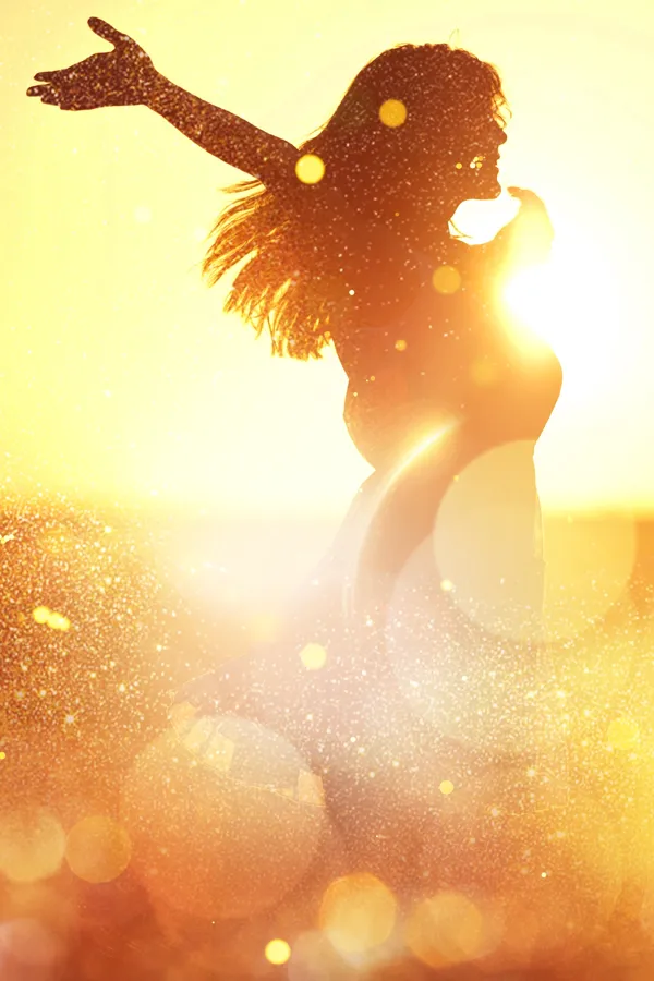 Adrenal-Testing-Treatment A woman with outstretched arms silhouetted by the sunset. Get adrenal testing from Markham Natural Health Centre in Greater Toronto.