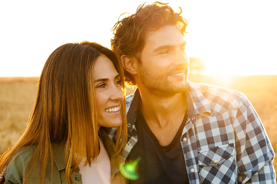 Allergy-Treatment-Clinic A healthy couple looking out over a cornfield in the fall with the sunset behind them. Get allergy treatment services from Markham Natural Health Centre in Greater Toronto.