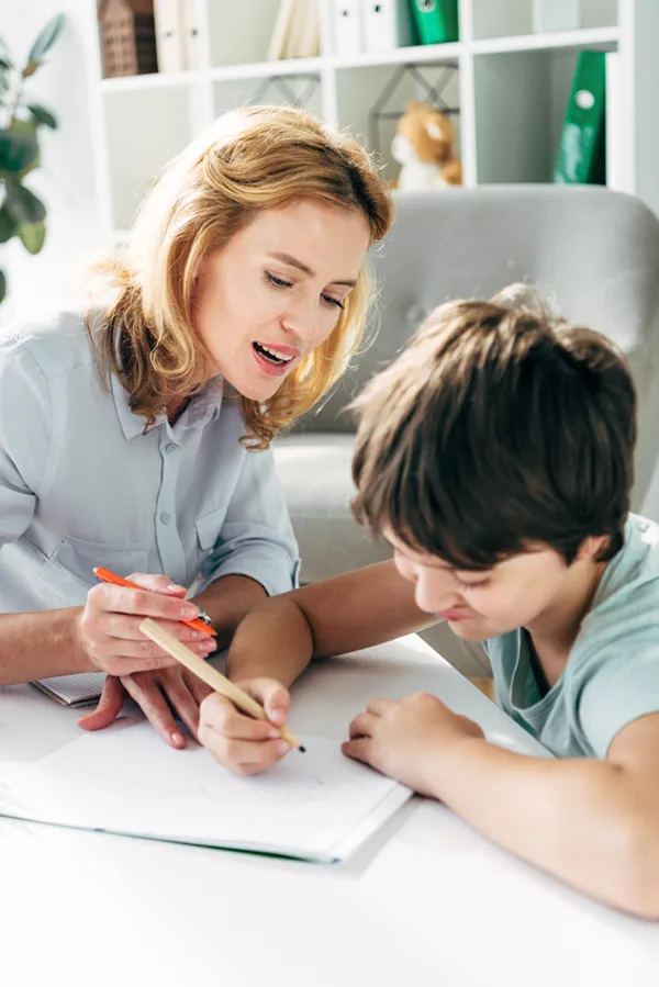 Autism-Treatment A therapist works with a child with Autism. Get treatment for autism from Markham Natural Health Centre in Greater Toronto.