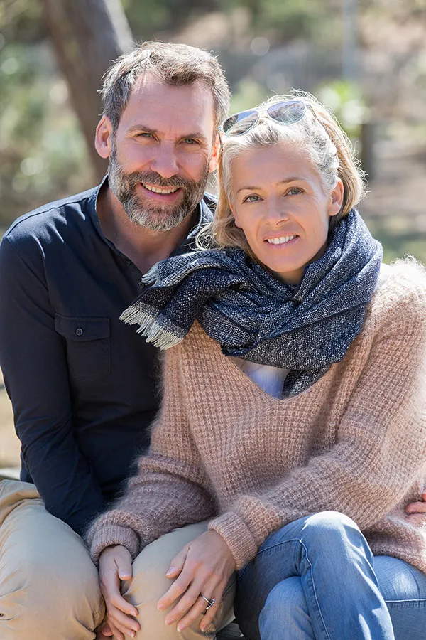 Inflammotory-Bowel-Disease-IBD-Treatment Happy middle-aged couple outdoors wearing cozy fall clothes, smiling calmly. Markham Natural Health Centre is a compassionate IBD specialist in Greater Toronto supporting long-term gut health and symptom relief through functional medicine.