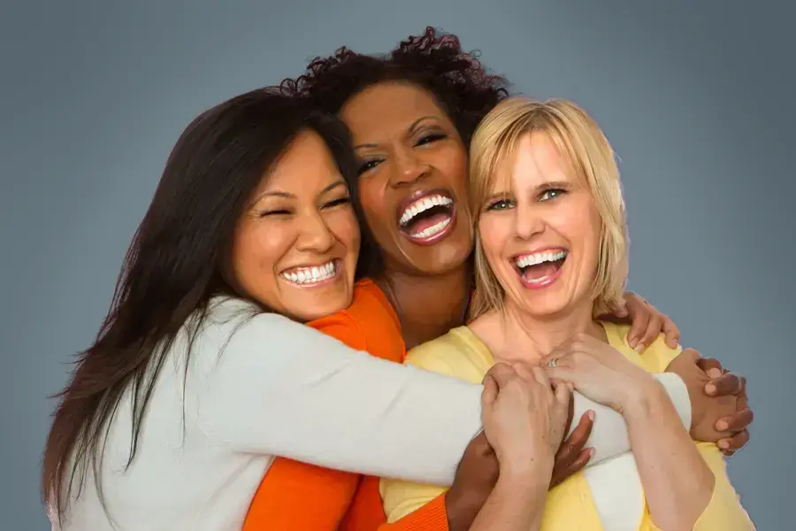 Insulin-Resistance-Clinic An asian, black, and white woman of middle age hug and laugh. Get insulin resistance treatment from Markham Natural Health Centre in Greater Toronto.