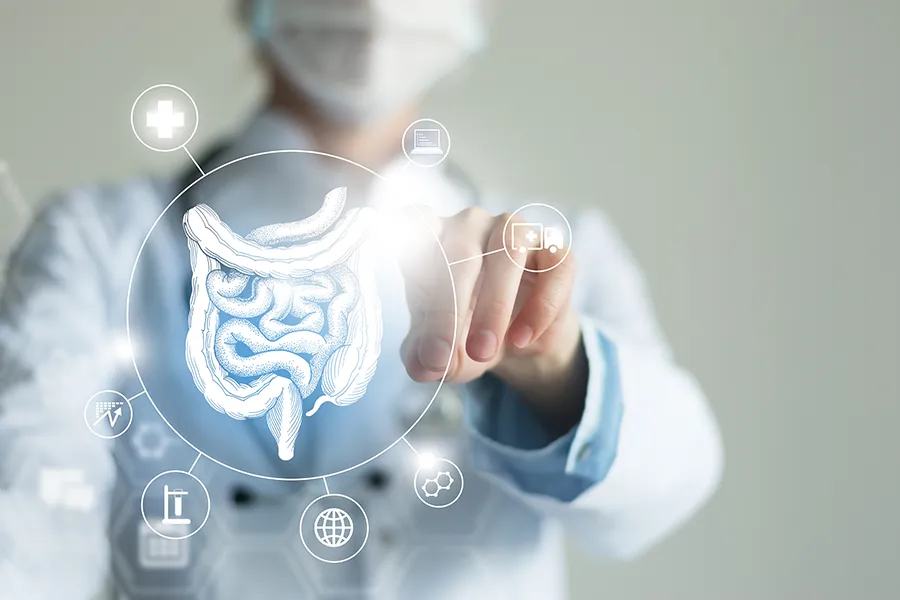 Leaky-Gut-Syndrome-Clinic Markham Natural Health Centre provides advanced Functional Medicine for Leaky Gut Syndrome treatments in Greater Toronto, shown by a doctor touching a glowing digital intestinal health display.
