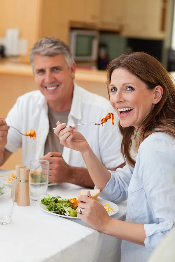 Leaky-Gut-Syndrome-Treatment Improve digestion with Markham Natural Health Centre's Functional Medicine for Leaky Gut Syndrome care in Greater Toronto, featuring a happy couple enjoying a nutritious lunch at home.