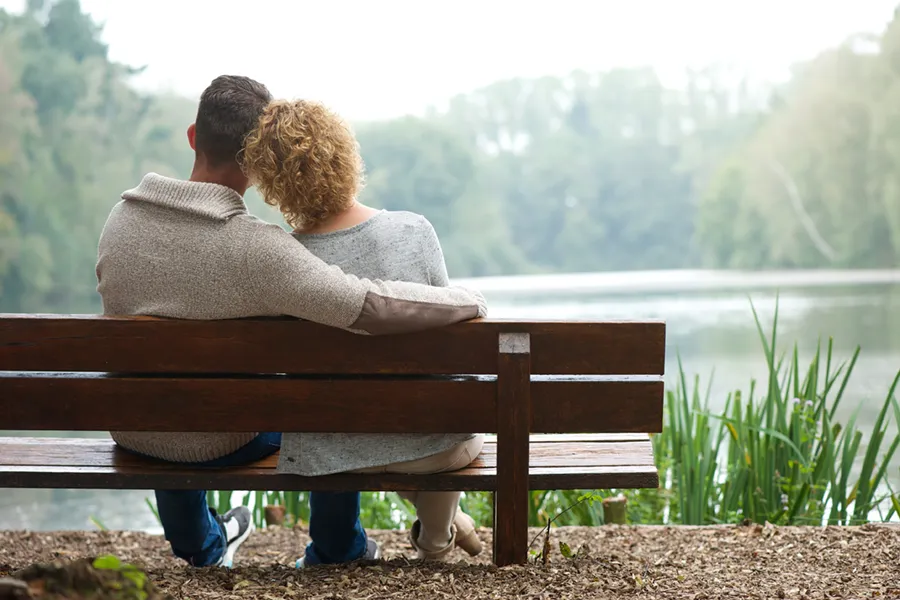 Naturopathic-Medicine-Doctor Peaceful outdoor scene of a couple embracing near the water, representing wellness, balance, and naturopathic care. Schedule your naturopathic medicine consultation with Markham Natural Health Centre in Greater Toronto.