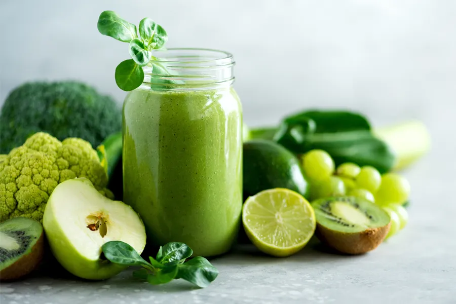Nutritional-Counseling-Clinic A tableau of healthy green fruits and vegetables and juices. Get nutritional counseling from Markham Natural Health Centre in Greater Toronto.